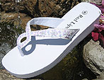White bridal flip flops with irridescent sequins and unique twist for your wedding.